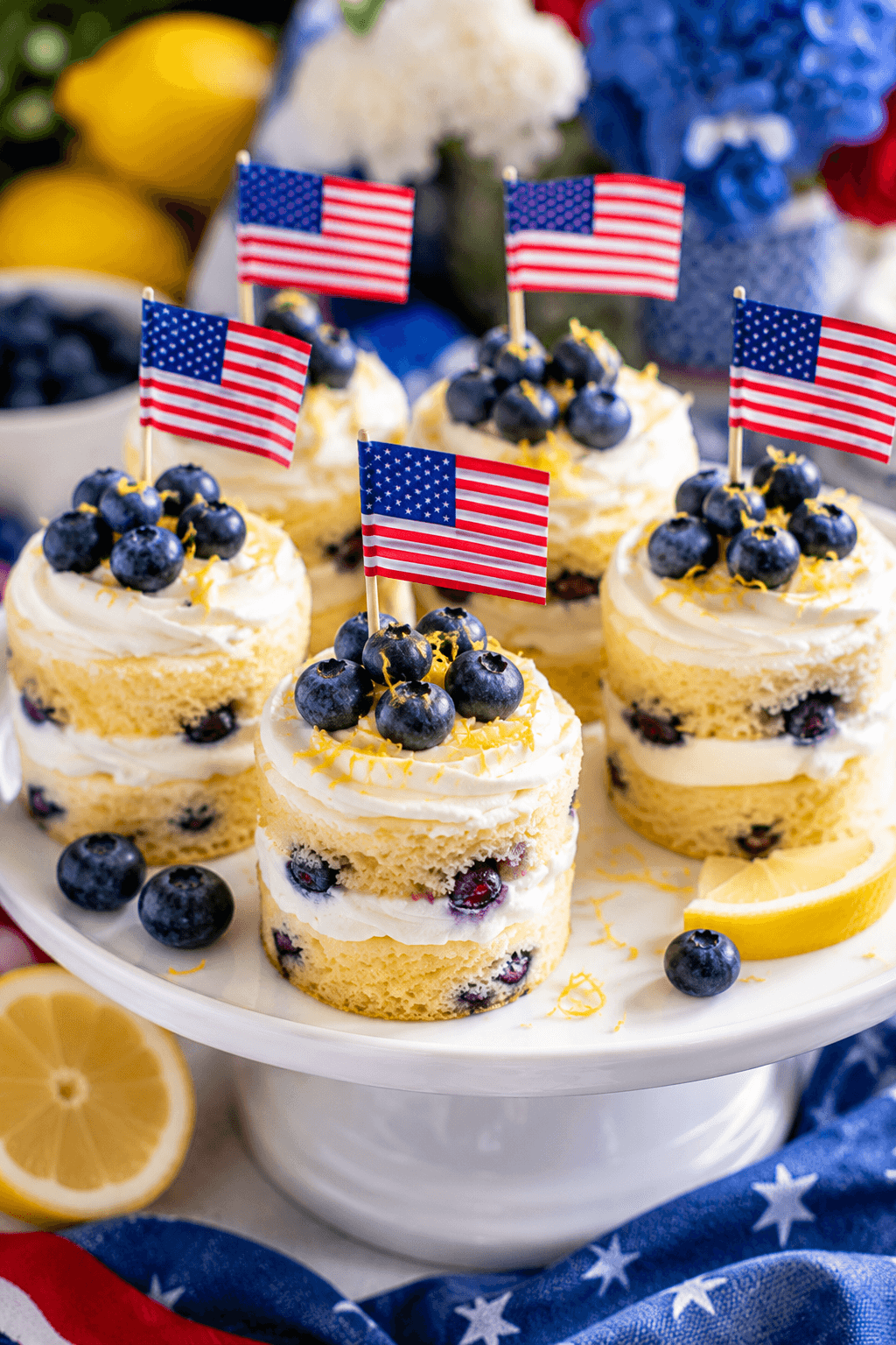 Lemon blueberry mini cakes topped with blueberries and lemon zest